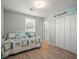 Cozy bedroom features ample closet space and a brightly patterned daybed, creating a warm retreat at 4005 W Coachman Ave, Tampa, FL 33611
