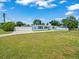 Spacious front yard with a paved driveway and manicured lawn surrounding the home at 4005 W Coachman Ave, Tampa, FL 33611