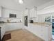 Beautiful kitchen with stainless steel appliances, granite countertops, white cabinets, and modern finishes, ideal for cooking at 4005 W Coachman Ave, Tampa, FL 33611