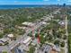 Aerial view of the home's location, showcasing the nearby ocean and dense, green trees at 427 21St N Ave, St Petersburg, FL 33704