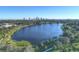 Scenic aerial view of a serene lake reflecting the city skyline against a clear blue sky at 427 21St N Ave, St Petersburg, FL 33704