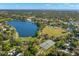 Community aerial view showcases green spaces, a lake, baseball field, and tennis courts at 427 21St N Ave, St Petersburg, FL 33704