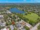 Aerial view of the home with the surrounding neighborhood, lake, and green spaces creating a scenic backdrop at 427 21St N Ave, St Petersburg, FL 33704