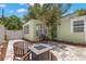Entertaining backyard with a fire pit seating area, barbecue, and lush landscaping at 427 21St N Ave, St Petersburg, FL 33704