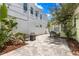 Paver patio with a barbecue and lush landscaping, offering an ideal backyard retreat at 427 21St N Ave, St Petersburg, FL 33704