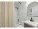 Well-lit bathroom with a modern vanity, shower/tub, and neutral color scheme at 427 21St N Ave, St Petersburg, FL 33704