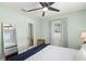 Comfortable bedroom featuring a ceiling fan, natural light, and neutral decor at 427 21St N Ave, St Petersburg, FL 33704