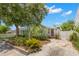 Charming home featuring a light green exterior, well-maintained landscaping, and a welcoming purple front door at 427 21St N Ave, St Petersburg, FL 33704