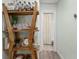 Hallway with stylish shelving leading to bathroom with a shower/tub combo at 427 21St N Ave, St Petersburg, FL 33704