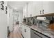 Contemporary kitchen featuring stainless steel appliances, marble counters, and white cabinets at 427 21St N Ave, St Petersburg, FL 33704