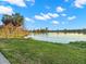 A scenic lake view with palm trees on the shore and a city skyline in the distance at 427 21St N Ave, St Petersburg, FL 33704