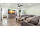 Inviting living room with comfortable seating, modern wood-look floors, and a view of the purple front door at 427 21St N Ave, St Petersburg, FL 33704