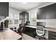 Office featuring sleek black built-in cabinets, dual monitors, and plenty of workspace at 427 21St N Ave, St Petersburg, FL 33704