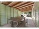 Spacious covered patio with a wooden picnic table and views into the outdoor space at 427 21St N Ave, St Petersburg, FL 33704
