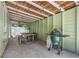 Charming covered patio with an outdoor kitchen, picnic table, and a backyard space at 427 21St N Ave, St Petersburg, FL 33704