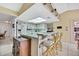 Bright kitchen with white cabinetry, bar seating, and ample counter space at 4388 Tiffin Ave, Spring Hill, FL 34609