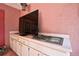 Outdoor kitchen with grill and countertops for easy entertaining on a covered patio at 4388 Tiffin Ave, Spring Hill, FL 34609
