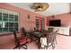 Covered patio with a ceiling fan and outdoor furniture, perfect for relaxing and entertaining at 4388 Tiffin Ave, Spring Hill, FL 34609
