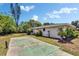 View of the side of the home with a concrete driveway, landscaping and beautiful blue sky at 4502 19Th Street Cir W, Bradenton, FL 34207