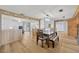 Open floor plan includes a dining room with wood table and chairs adjacent to the kitchen at 525 Gornto Lake Rd, Brandon, FL 33510