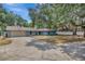 Charming single-story home featuring a spacious driveway, two-car garage, and mature landscaping at 525 Gornto Lake Rd, Brandon, FL 33510