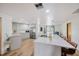 Modern kitchen boasts a large island with seating, stainless steel appliances, and ample counter space at 525 Gornto Lake Rd, Brandon, FL 33510