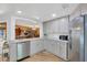 Well-lit kitchen featuring stainless steel appliances, light grey cabinetry, and modern fixtures at 525 Gornto Lake Rd, Brandon, FL 33510