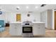 Bright kitchen features a large island, stainless steel oven, and pristine white cabinetry at 525 Gornto Lake Rd, Brandon, FL 33510