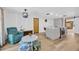 Bright living area with an oversized chair and ottoman is located near the kitchen at 525 Gornto Lake Rd, Brandon, FL 33510