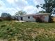 View of the backyard with lawn and deck at 5991 42Nd N Ave, St Petersburg, FL 33709