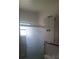 Bright bathroom featuring a glass shower door and a white cabinet for storage at 5991 42Nd N Ave, St Petersburg, FL 33709