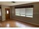 View of the living room with hardwood floors and several windows at 5991 42Nd N Ave, St Petersburg, FL 33709