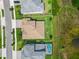 A bird's eye view reveals the well-maintained roof and landscaping of a home nestled amongst other homes in a tidy neighborhood at 6154 Marsh Trail Dr, Odessa, FL 33556