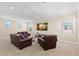 Relaxing bonus room featuring carpet flooring, recessed lighting, and comfortable leather seating around a center table at 6154 Marsh Trail Dr, Odessa, FL 33556