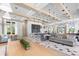 Spacious clubhouse featuring modern design, ample seating, and a stylish kitchen area at 6154 Marsh Trail Dr, Odessa, FL 33556