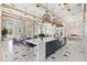 Bright clubhouse kitchen with quartz counters, pendant lights, and seating at 6154 Marsh Trail Dr, Odessa, FL 33556