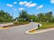 A welcoming entrance to the Tarramor community features manicured landscaping and a secure gated entry for residents at 6154 Marsh Trail Dr, Odessa, FL 33556