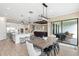 Open layout features a dining area connected to kitchen and living space, perfect for entertaining at 6154 Marsh Trail Dr, Odessa, FL 33556