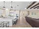 Modern kitchen features a center island with stool seating and stainless steel appliances at 6154 Marsh Trail Dr, Odessa, FL 33556