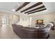 Spacious living room with beamed tray ceiling and stairs to the second story at 6154 Marsh Trail Dr, Odessa, FL 33556