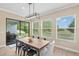 Outdoor patio seating with a grill overlooks a serene view, providing an ideal space for relaxation at 6154 Marsh Trail Dr, Odessa, FL 33556