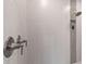Up close, the stand up shower boasts tiled walls, with modern fixtures and a niche for storage at 6154 Marsh Trail Dr, Odessa, FL 33556