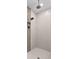 A stand up shower features tiled walls, modern fixtures and a niche for storage at 6154 Marsh Trail Dr, Odessa, FL 33556