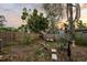 Private backyard with a wooden fence, mature trees, and a cozy seating area for outdoor relaxation at 6251 4Th S Ave, St Petersburg, FL 33707