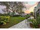 Expansive backyard with a well-maintained lawn, comfortable seating, and mature landscaping, perfect for outdoor entertaining at 6251 4Th S Ave, St Petersburg, FL 33707