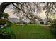 Expansive backyard featuring a well-manicured lawn, swimming pool, and ample space for recreation and entertaining at 6251 4Th S Ave, St Petersburg, FL 33707