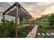 Inviting backyard features a pergola and serene landscaping at 6251 4Th S Ave, St Petersburg, FL 33707