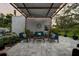 Backyard patio with an outdoor seating area and a pergola creating an inviting gathering space at 6251 4Th S Ave, St Petersburg, FL 33707