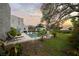 Spacious backyard featuring a beautiful pool, lush lawn, mature trees, and lovely landscaping at 6251 4Th S Ave, St Petersburg, FL 33707
