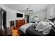 Bright bedroom featuring a ceiling fan, natural light, and a comfortable bed with decorative pillows at 6251 4Th S Ave, St Petersburg, FL 33707